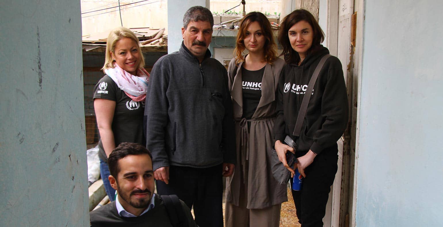 group visiting refugee camp